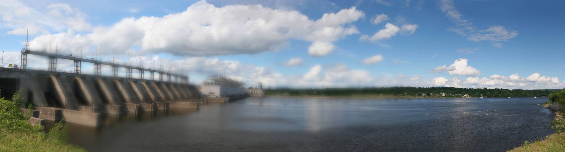 Image of ATS ARC800 Sensor Fish used as a fish simulator by fish researchers; shown with background of a hydro-power dam installation on a river